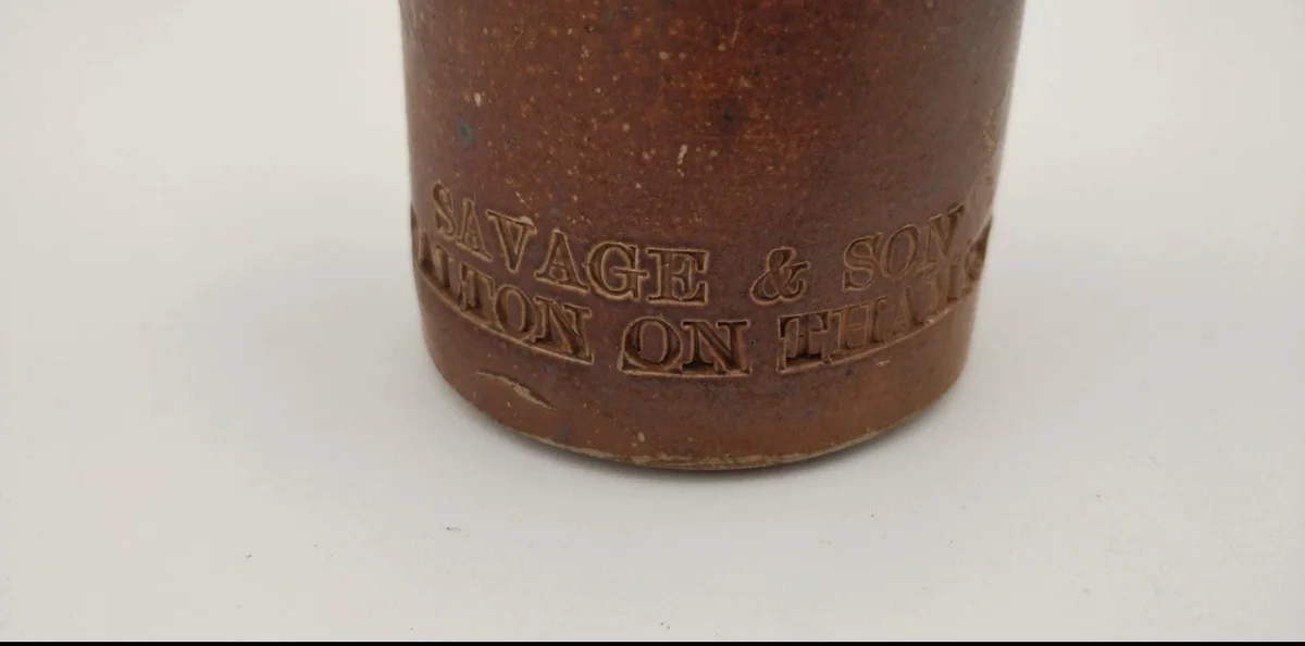 The base of the stoneware Savage & Son bottle, embossed 'SAVAGE & SON, WALTON ON THAMES'