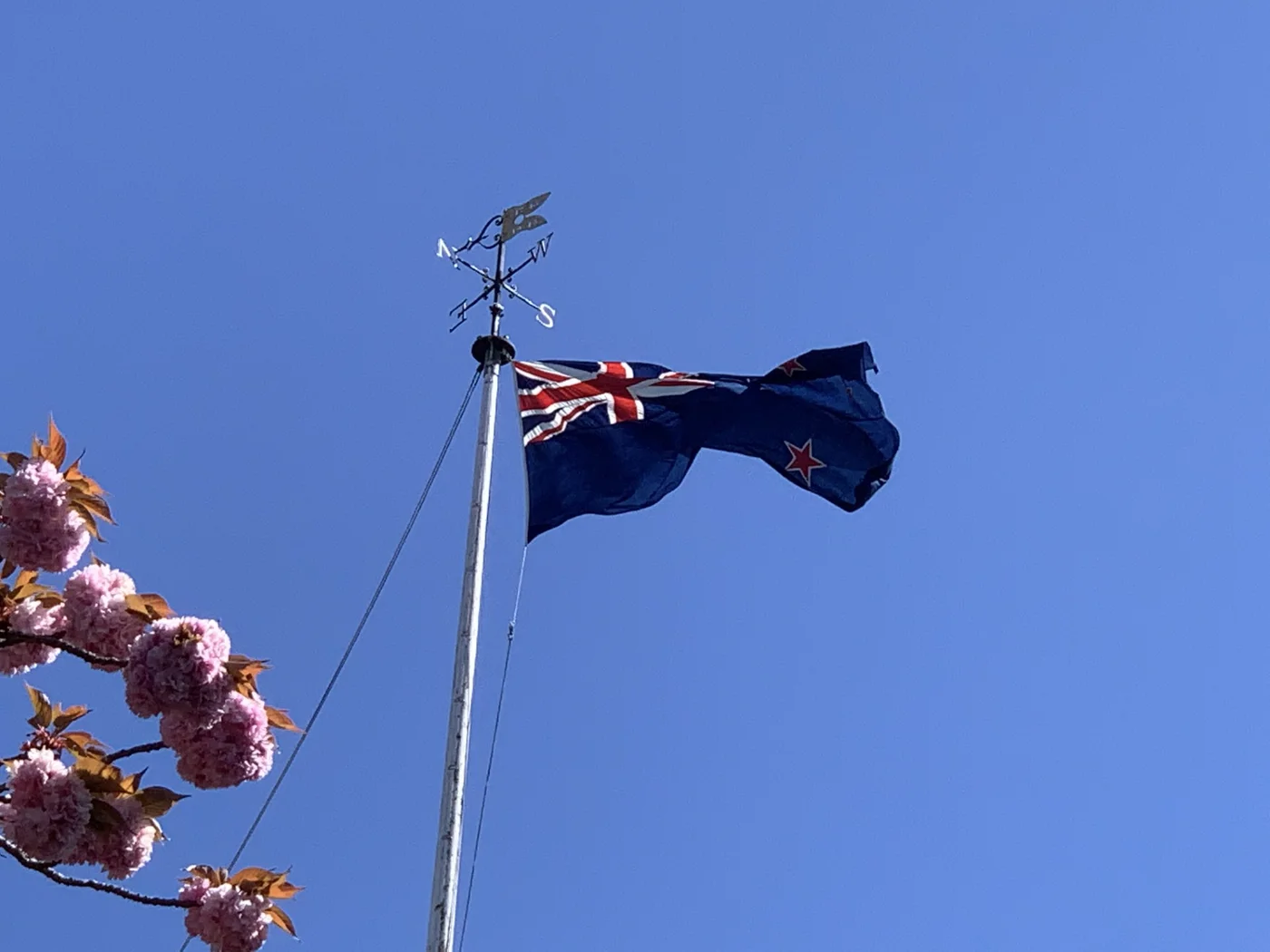 Close view of the New Zealand flag flying from St Mary's Church tower, Walton-on-Thames